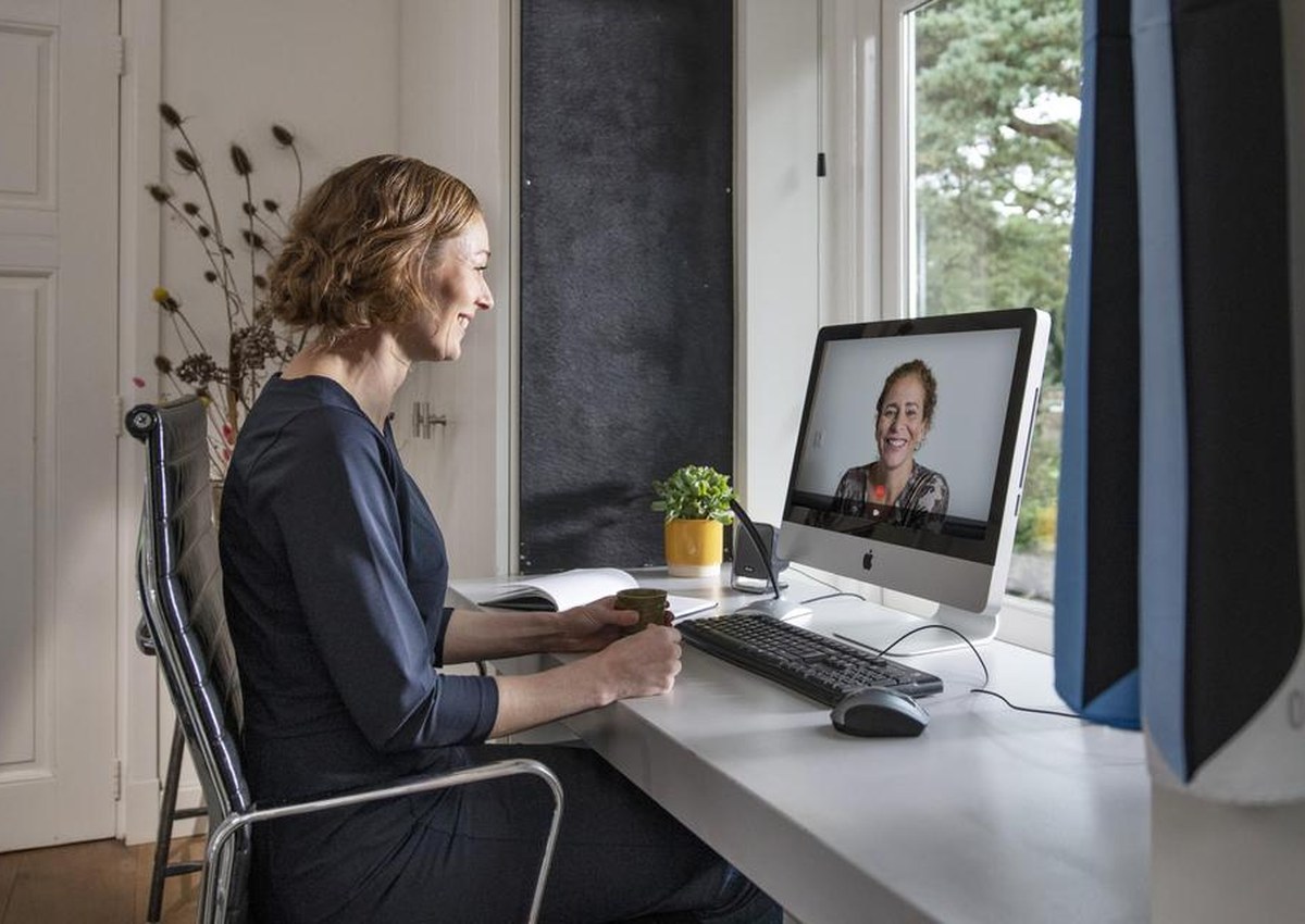 Virtual healthcare consultation with notes and planning materials